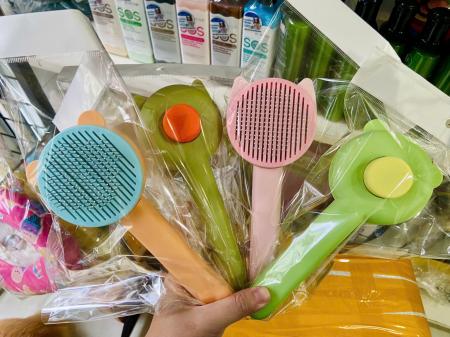 LƯỢC NHỰA BẤM CHẢI LÔNG - HÌNH TAI MÈO